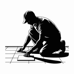 Silhouette of a construction worker laying tile on a floor