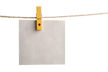 Wooden clothespin holding paper on string isolated on white background