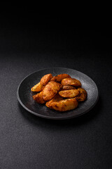 Potato wedges baked with spices, garlic and rosemary. Potato wedges