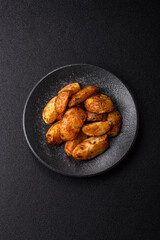 Potato wedges baked with spices, garlic and rosemary. Potato wedges