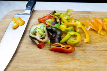 Finely chopped vegetables on a cutting board. 