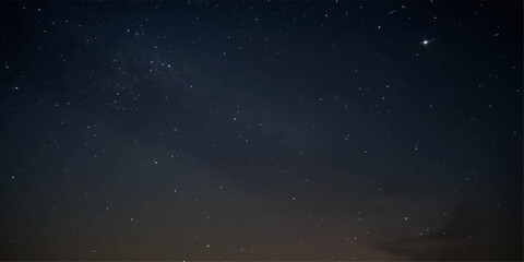 A stunning blue starry night sky with a bright galaxy and cosmic dust