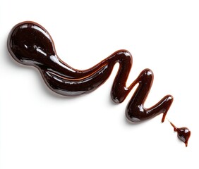 Dark, viscous sauce drizzled in a flowing pattern