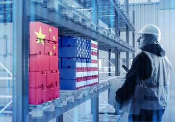 Worker in warehouse with boxes showing China and USA flags, representing global trade, import export, logistics, supply chain. Logistics, Trade, Supply chain.