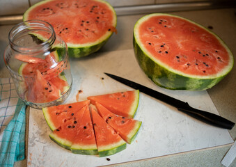slices of watermelon, watermelon is cut into pieces and placed in a jar