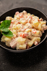 Potato salad ham, potato, tomato, carrot, mayonnaise tasty snack fresh delicious gourmet food background on the table rustic top view copy space