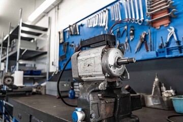This collection of high-resolution images captures the intricate process of repairing and assembling electric motors inside a professional industrial workshop.