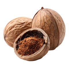 Ground nutmeg in a cracked nutmeg shell with whole nutmegs