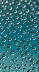 Close up of water droplets on a blue surface creating an abstract background