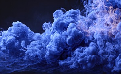 Abstract ink swirling in deep blue and amber