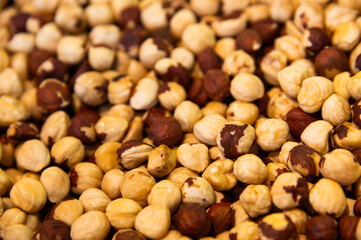 Nut background. Heap of peeled hazelnuts. Top view of roasted beautiful peeled hazelnuts