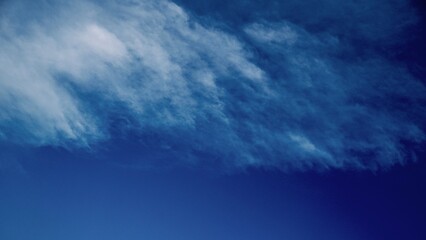 Deep Blue Sky with Sweeping Cloud Layers
