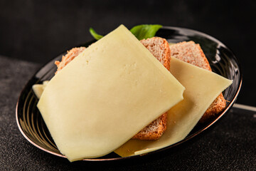 Gouda cheese slices hard cheese variety natural product tasty snack fresh delicious gourmet food background on the table rustic top view copy space