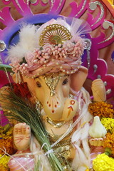 Ganapati festival celebration at home with a beautifully decorated Ganesh idol, flowers, lights, and traditional offerings, symbolizing devotion, prosperity, and cultural heritage in a festive atmosph