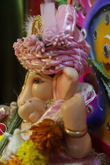 Ganapati festival celebration at home with a beautifully decorated Ganesh idol, flowers, lights, and traditional offerings, symbolizing devotion, prosperity, and cultural heritage in a festive atmosph