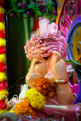 Ganapati festival celebration at home with a beautifully decorated Ganesh idol, flowers, lights, and traditional offerings, symbolizing devotion, prosperity, and cultural heritage in a festive atmosph