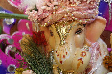 Ganapati festival celebration at home with a beautifully decorated Ganesh idol, flowers, lights, and traditional offerings, symbolizing devotion, prosperity, and cultural heritage in a festive atmosph