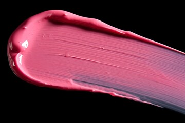 Abstract pink acrylic color brush stroke on black background.