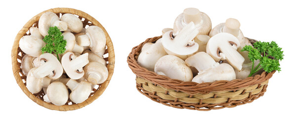 Fototapeta premium Fresh mushroom champignon in a wicker basket isolated on white background. Top view. Flat lay.