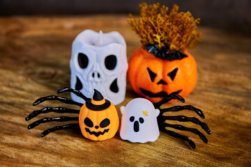 warm halloween card with skull, jack o pumpkins, two black hands and ghost close-up, congratulations on All Saints Day, creative focus