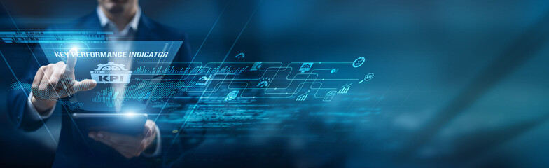 Performance officer using a smart tablet for performance monitoring KPIs, tracking efficiency...