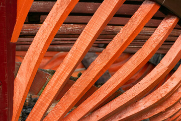 An abstract design of the orange wooden ribs of a boat The Geometry of Craftsmanship