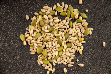 Seed mix sunflower seeds and pumpkin seeds natural product tasty snack fresh delicious gourmet food background on the table rustic top view copy space keto and paleo diet vegan and vegan food