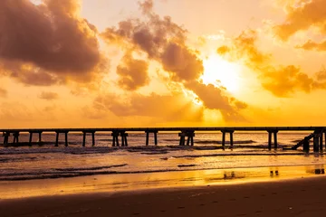Fototapeten Pier Butwani bridge and Malindi Pier area is a popular waterfront location known for stunning sunrises over the Indian Ocean. The pier is a concrete jetty that stretches about 400 meters into the ocean and  © Antony Trivet