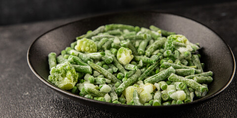 Frozen green vegetables green peas, broccoli, string beans, kohlrabi kale tasty snack fresh food...