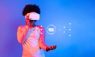 A woman explores virtual reality technology, engaging with digital data icons that represent modern information management tools. Vibrant blue background enhances the immersive experience. XDMCP