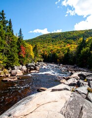 Autumn river flowing through rocky landscape