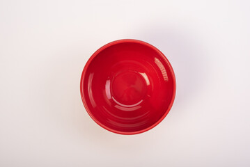 Beautiful ceramic pot placed on a white background, selective focus. Top view.