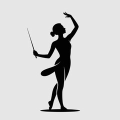 Obraz premium Silhouette of a graceful ballerina performing a ballet pose with a wand