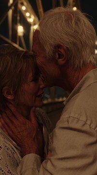 Elderly Couple Holding Hands in Love under String Lights &ndash; Romantic Evening