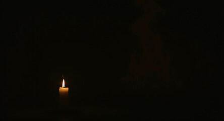 Single Candle Flame in Darkness, Hope and Reflection