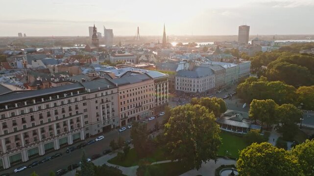 Aerial view of Riga, Latvia, featuring the Monument of Freedom, historic architecture, St. Peter's Church, Riga Cathedral, and the Daugava River.
