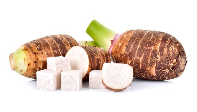 Fresh taro root cubes and whole root