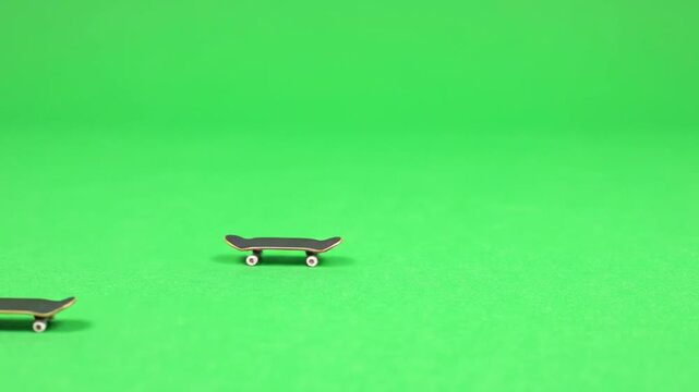 skateboard rolling slowly on green screen,