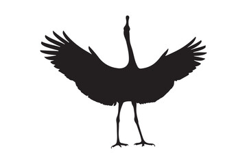 Silhouette of a crane with wings spread wide