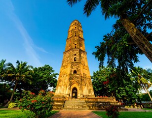 Ancient tower amidst tropical foliage
