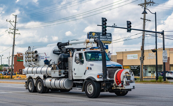Park Ridge, Illinois, USA - August 17, 2024: 2006 Sterling L9500 Vactor 2112-J6 hydro excavation truck. Excavation truck of Sterling L9500. Truck of Sterling L9500 on road. Sterling truck, side view