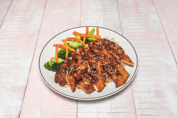 Chinese-Style Almond Chicken: Diced chicken breast with a thick soy sauce, ginger, and toasted almonds for a crunchy contrast