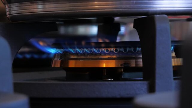 lit stovetop with frying pan
