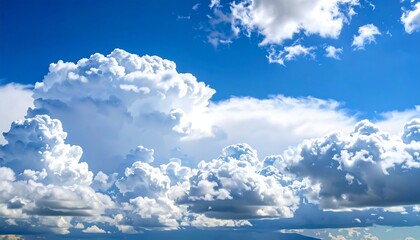 Expansive blue sky filled with fluffy white clouds, capturing a serene natural landscape