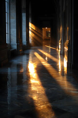 Fototapeta premium Golden Rays Cutting Across Dark Stone Hallway