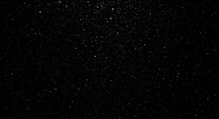 Obraz premium A mesmerizing view of the cosmos, capturing the splendor of countless stars scattered across the deep expanse of space. The blackness of the night sky serves as a perfect backdrop for the shining, dis