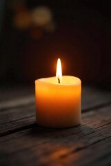 Close-up of a flickering candle flame, casting warm, inviting light and soft shadows on a rustic wooden surface  Perfect for ambiance, relaxation, and spa themes ,  night,  candlelight,  soft