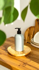 Light gray pump bottle on wooden tray, kitchen