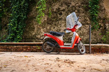 Charming Red Scooter Resting on a Sicilian Street