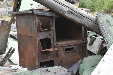 Rusted stove in the ruins